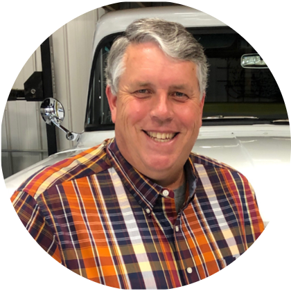 headshot of Todd Axtell standing infront of a truck